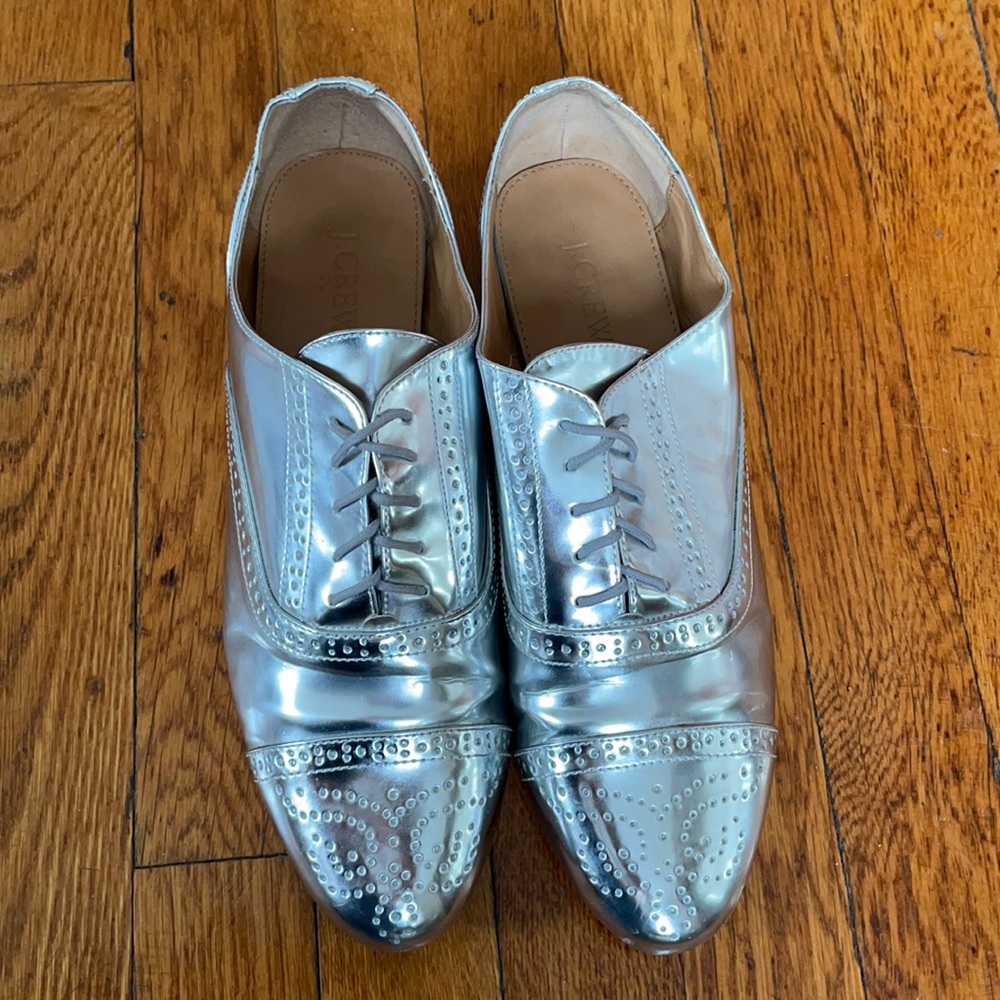Shiny silver Oxford lace up shoes.